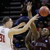 Iowa State forward Georges Niang (31) pass the ball as North Carolina Central forward Jay Copeland (1) defends during the first half of a second-round game in the NCAA college basketball tournament Friday, March 21, 2014, in San Antonio. Iowa State forward Georges Niang (31) pass the ball as North Carolina Central forward Jay Copeland (1) defends during the first half of a second-round game in the NCAA college basketball tournament Friday, March 21, 2014, in San Antonio.