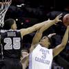 North Carolina's Kennedy Meeks (3) shoots as Providence's Tyler Harris (25) defends during the first half of a second-round game in the NCAA college basketball tournament Friday, March 21, 2014, in San Antonio. North Carolina's Kennedy Meeks (3) shoots as Providence's Tyler Harris (25) defends during the first half of a second-round game in the NCAA college basketball tournament Friday, March 21, 2014, in San Antonio.