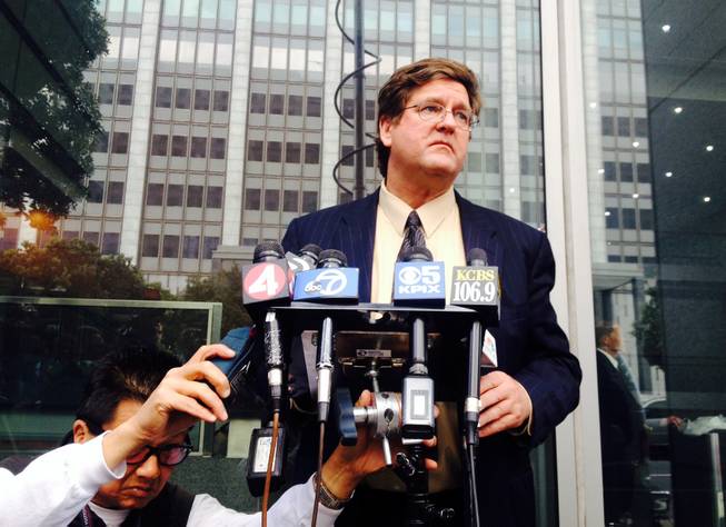 Attorney Paul Demeester reads a letter that California state Sen. Leland Yee sent to California Secretary of State Debra Bowen on Thursday, March 27, 2014 informing her that he was withdrawing his candidacy, during a news conference in San Francisco. The California state senator accused of accepting bribes and introducing an undercover agent to an arms trafficker is dropping out of the race for California secretary of state. State legislators have called on Yee to step down from the state Senate.