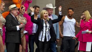 Olivia Newton-John makes her official Las Vegas arrival with a welcome event at the Flamingo with Las Vegas Host Committee Chairman Oscar Goodman and Clark County Commissioner Tom Collins on Wednesday, April 2, 2014.