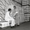 Photo: Larry Ruvo and Jerry Vallen look over a bottle of Photo: Larry Ruvo and Jerry Vallen look over a bottle of