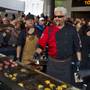 Guy Fieri works a patio grill at The Quad helping to serve burgers to fans outside his first Las Vegas restaurant, Guy Fieri's Vegas Kitchen & Bar on Friday, April 4, 2014.