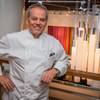 Photo: Wolfgang Puck signs copies of his newly released c Photo: Wolfgang Puck signs copies of his newly released c