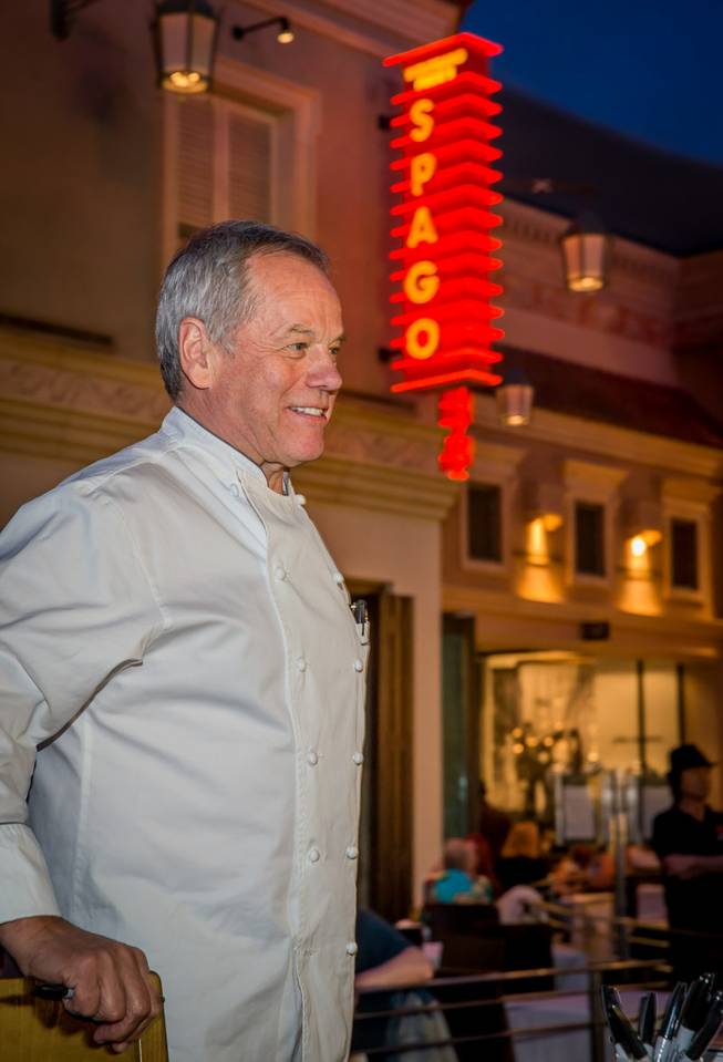 Wolfgang Puck signs copies of his newly released cookbook "Wolfgang Puck Makes It Healthy: Light, Delicious Recipes and Easy Exercises for a Better Life," on Wednesday, April 9, 2014, in front of his restaurant Spago at the Forum Shops in Caesars Palace.