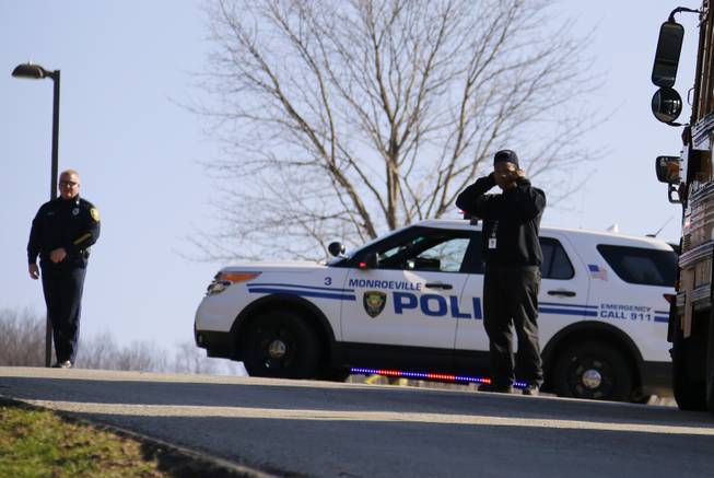 Emergency responders gather in the parking lot of the high school on the campus of the Franklin Regional School District, where several people were stabbed at Franklin Regional High School, on Wednesday, April 9, 2014, in Murrysville, Pa., near Pittsburgh. The suspect, a male student, was taken into custody and being questioned.