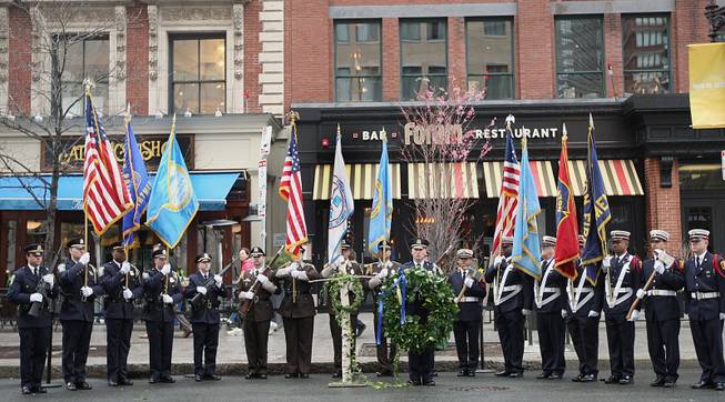Honor Guard members line up in front of the Forum Restaurant in Copley Square, where a wreath laying ceremony was held to commemorate the one year anniversary of the Boston Marathon bombings, Tuesday, April 15, 2014. (AP Photo/The Boston Globe, Wendy Maeda) BOSTON HERALD OUT, QUINCY OUT; NO SALES