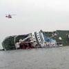 Photo: South Korean rescue helicopters fly over a South K Photo: South Korean rescue helicopters fly over a South K