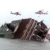 Photo: Rescue helicopters fly over a sinking South Korean Photo: Rescue helicopters fly over a sinking South Korean