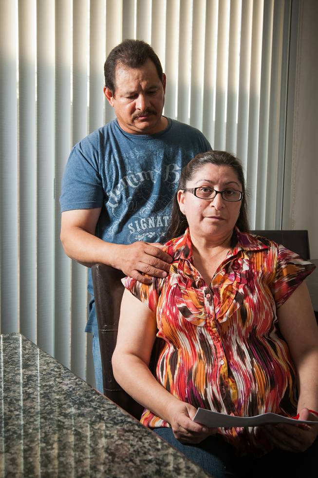 Jorge Espinosa stands beside his wife Maria, of 30 years who has received her deportation orders to return to Mexico, while living in their daughter's home in North Las Vegas Monday, April 15, 2014. The Espinosas have U.S. citizen children and have lived in the United States for over two decades and continue to fight for their U.S. citizenship.