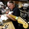 Photo: A finished Fender Stratocaster is adjusted by Kenn Photo: A finished Fender Stratocaster is adjusted by Kenn