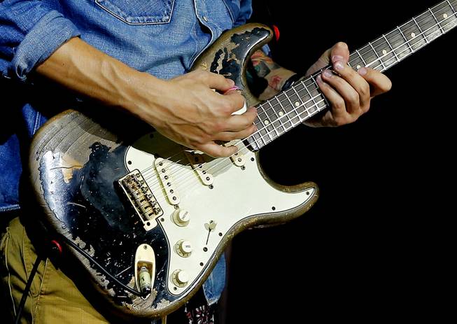 John Mayer performs with his Fender Stratocaster electric guitar in Phoenix on Thursday, Oct. 3, 2013. When asked how the Stratocaster has shaped his creative process, he says, "It's the machine of my dreams. It's the Ford Mustang, the Marilyn Monroe, the lightning rod, surfboard, magic carpet for music." The iconic instrument, used by countless professional and amateur musicians, celebrates its 60th anniversary in 2014.