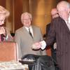 Former Las Vegas Mayor Oscar Goodman hands one of the stacks of hundred dollar bills to current Las Vegas Mayor Carolyn G. Goodman after The Mob Museum paid the city a whopping $1.5 million in cash at a council meeting on April 16, 2014.
Former Las Vegas Mayor Oscar Goodman hands one of the stacks of hundred dollar bills to current Las Vegas Mayor Carolyn G. Goodman after The Mob Museum paid the city a whopping $1.5 million in cash at a council meeting on April 16, 2014.