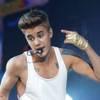 Photo: In this March 19, 2013, photo, singer Justin Biebe Photo: In this March 19, 2013, photo, singer Justin Biebe
