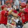 Photo: Los Angeles Angels Albert Pujols, right, is congra Photo: Los Angeles Angels Albert Pujols, right, is congra