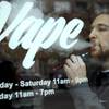 Photo: Eric Scheman demonstrates an e-cigarette at Vape s Photo: Eric Scheman demonstrates an e-cigarette at Vape s