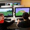 Bobby Craig, left, and Doogy Lee create worlds in "Minecraft" that parallel what they have been reading in "The Hobbit" as part of their fifth grade class studies at Quest Academy in Palatine, Ill. Bobby Craig, left, and Doogy Lee create worlds in "Minecraft" that parallel what they have been reading in "The Hobbit" as part of their fifth grade class studies at Quest Academy in Palatine, Ill.