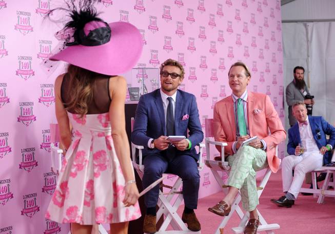 IMCelebrity judges Simon Baker, center, and Carson Kressley, right, judge the Longines Kentucky Oaks Fashion Contest on Kentucky Oaks Day, Friday, May 2, 2014, in Louisville, Ky. Longines, the Swiss watch manufacturer known for its luxury timepieces, is the Official Watch and Timekeeper of the 140th annual Kentucky Derby.