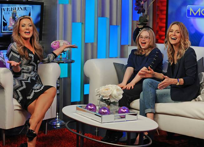 More co-host Rachel Smith, left, has some fun with guests Michelle Desrochers, from Opportunity Village, center, and Las Vegas performer Veronic DiCaire in the Fox 5 studios while taping a segment discussing Veronic's new program "Lend Your Voice" where she invites special guests to the stage during her performances to benefit local charities.