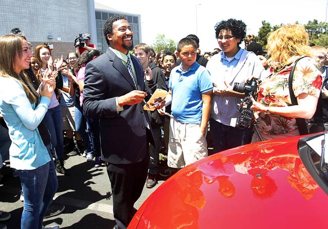 Math teacher Perryn Hale gets his first look at his new car on the final day of Teacher Appreciation Week at Roy Martin Middle School Friday, May 9, 2014. Appreciation Financial, an insurance and financial services company and Findlay Chevrolet teamed up to give Hale a fully-loaded 2014 Chevrolet Sonic RS Turbo.