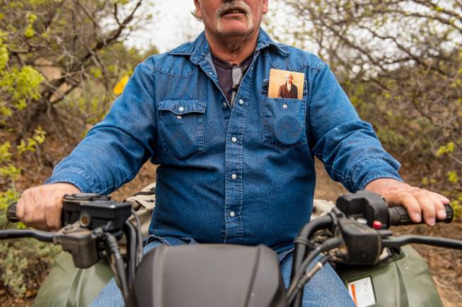 An ATV rider and others drive through Recapture Canyon, north of Blanding, Utah, on Saturday, May 10, 2014, in a protest against what demonstrators call the federal government's overreaching control of public lands. The area has been closed to motorized use since 2007 when an illegal trail was found that cuts through Ancestral Puebloan ruins. The canyon is open to hikers and horseback riders.