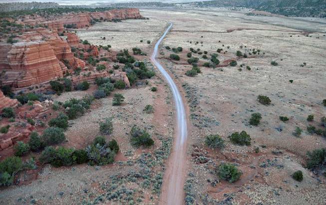 This June 2013 photo provided by the University of North Florida Office of Research, shows an aerial photo taken from a drone of the Blue J area in northwestern New Mexico. Researchers outfitted a customized drone with a heat-sensing camera to unearth what they believe are ceremonial pits and other features at the site of an ancient village in New Mexico.