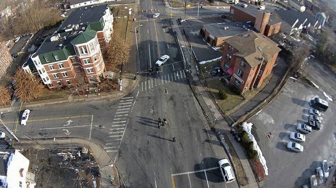 This Feb. 1, 2014 photo, taken by a camera mounted on a drone aircraft and provided by Pedro Rivera, shows an auto that crashed into a building in Hartford, Conn. Rivera filed a federal lawsuit Tuesday, Feb. 18, 2014, alleging that Hartford police officers violated his rights by demanding he stop using the aircraft to record images of the wreck.