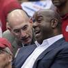 Photo: NBA Commissioner Adam Silver talks with Magic John Photo: NBA Commissioner Adam Silver talks with Magic John