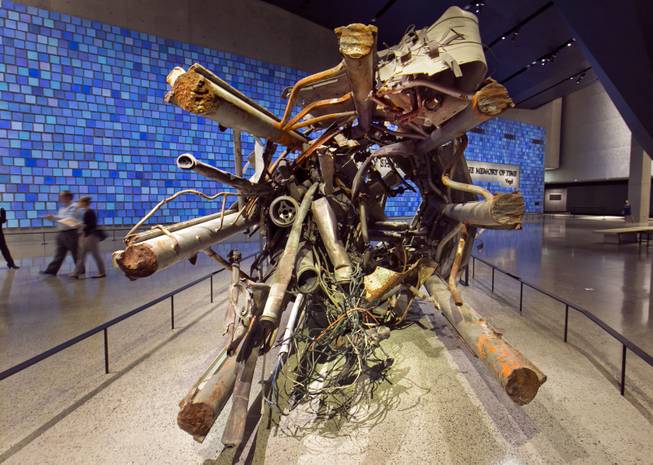 The twisted remains of a portion of the television transmission tower from the World Trade Center is displayed at the National Sept. 11 Memorial Museum, Wednesday, May 14, 2014, in New York. The museum is a monument to how the Sept. 11 terror attacks shaped history, from its heart-wrenching artifacts to the underground space that houses them amid the remnants of the fallen twin towers' foundations. It also reflects the complexity of crafting a public understanding of the terrorist attacks and reconceiving ground zero. (AP Photo)