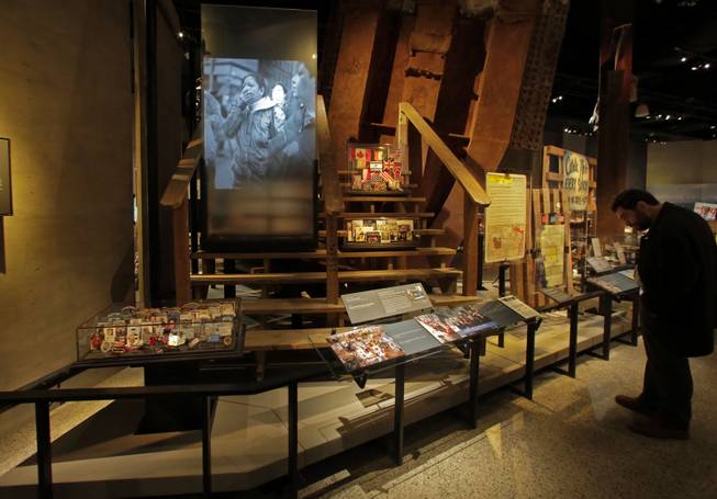 The Family Viewing Platform, and memorabilia from the World Trade Center, are displayed at the National Sept. 11 Memorial Museum, Wednesday, May 14, 2014, in New York. The museum is a monument to how the Sept. 11 terror attacks shaped history, from its heart-wrenching artifacts to the underground space that houses them amid the remnants of the fallen twin towers' foundations. It also reflects the complexity of crafting a public understanding of the terrorist attacks and reconceiving ground zero. (AP Photo)