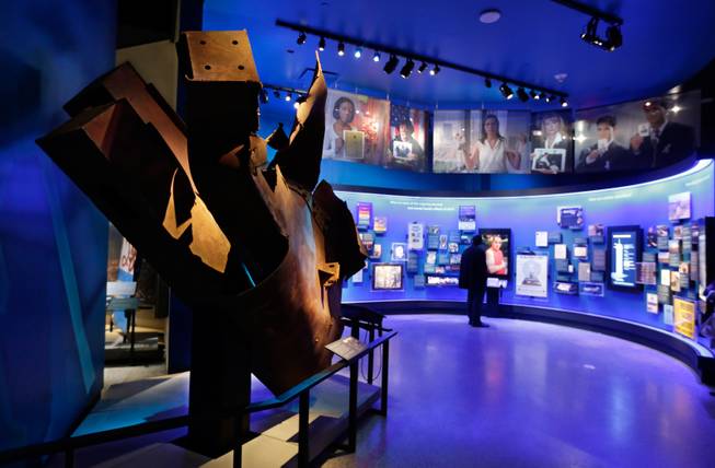 Steel from the World Trader Center north tower floors 97 and 98, left, is displayed at the National Sept. 11 Memorial Museum, Wednesday, May 14, 2014, in New York. The museum is a monument to how the Sept. 11 terror attacks shaped history, from its heart-wrenching artifacts to the underground space that houses them amid the remnants of the fallen twin towers' foundations. It also reflects the complexity of crafting a public understanding of the terrorist attacks and reconceiving ground zero. (AP Photo)