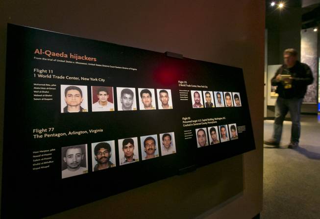 Portraits of the Al-Qaeda hijackers are displayed at the National Sept. 11 Memorial Museum, Wednesday, May 14, 2014, in New York. The museum is a monument to how the Sept. 11 terror attacks shaped history, from its heart-wrenching artifacts to the underground space that houses them amid the remnants of the fallen twin towers' foundations. It also reflects the complexity of crafting a public understanding of the terrorist attacks and reconceiving ground zero. (AP Photo)