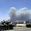 Photo: Marines move military vehicles near the entrance t Photo: Marines move military vehicles near the entrance t