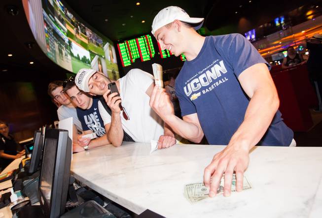 On Saturday, May 24, 2014, graduates of the University of Connecticut stopped by Hard Rock Hotel Las Vegas to pick up their winnings: a total of $60,000. From left: Paul Delvecchio, Marc Demattie, Ferid Frank Feratovic and Tom Andreoli at the Hard Rock sports book.