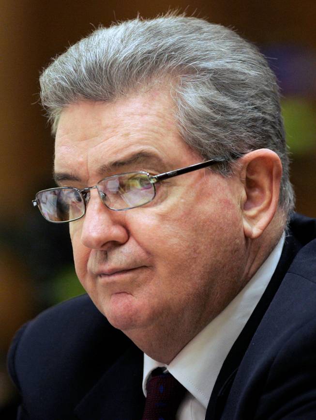 In this Oct. 1, 2008, file photo, former FBI agent John Connolly listens to the testimony in his trial, in Miami, Fla. The 3rd District Court of Appeal ruled Wednesday, May 28, 2014, that Connolly was improperly convicted and sentenced to 40 years in prison for his role in the 1982 slaying of World Jai-Alai President John Callahan.