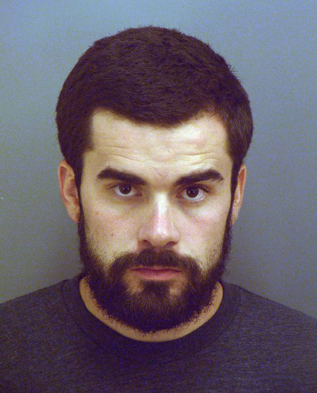 This May 26, 2014 booking photo provided by the El Paso County Sheriff's Office shows Ryan Jean in El Paso, Texas. Jean was arrested for painting threatening graffiti on two billboards in El Paso with messages very similar to those used by Mexican drug cartels.