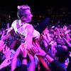 Photo: Macklemore crowd surfs during Surrender and Encore Photo: Macklemore crowd surfs during Surrender and Encore