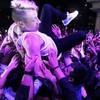 Photo: Macklemore crowd surfs during Surrender and Encore Photo: Macklemore crowd surfs during Surrender and Encore