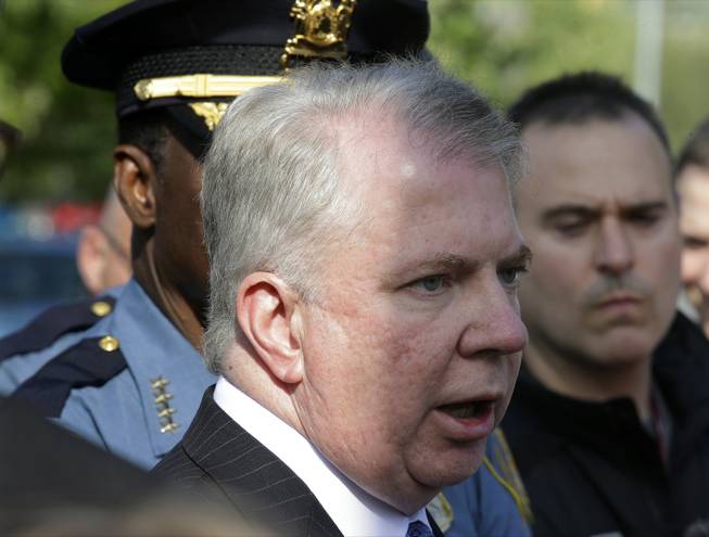 Seattle Mayor Ed Murray talks to reporters at the scene of a shooting Thursday, June 5, 2014, at Seattle Pacific University in Seattle. A lone gunman armed with a shotgun opened fire in a building at the small university, killing one person before he was subdued by a student as he tried to reload, police said. Police say the student building monitor disarmed the gunman and several other students held him until police arrived at the Otto Miller building. (AP Photo/Ted S. Warren)
