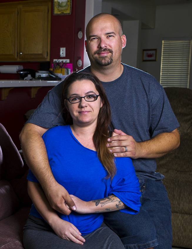 Jill Parker with husband Robert, daughter Mariah, 15, and son Kurt, 14, has a litany of autoimmune diseases and hasn't been able to see a doctor because she can't afford the cost on Friday, June 6, 2014. She needed a team of lawyers, insurance experts and a little help from the government to sign up for a health care plan on the Silver State Exchange.