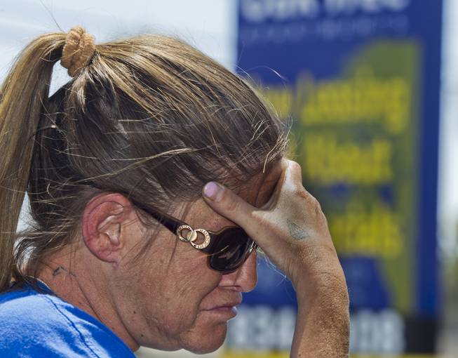 Kelley Fielder is overcome with emotions while talking about her friend Amanda Miller who lived across the way from her at the Oak Tree Apartments on Monday, June 9, 2014. She is in deep regret for not going to authorities with her concerns about the Miller's and the dangerous comments she had heard them make.