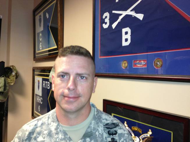 Lt. Col. Patrick Harkins poses for a photo on May 19, 2014, at Fort Campbell, Ky. Harkins has followed in his dad's footsteps. His dad, retired Col. Bob Harkins, led the "Rakkasans," the 187th Infantry Division, 3rd Brigade Combat Team of the 101st Airborne Division at Fort Campbell into combat at the Battle of Hamburger Hill in May 1969 in Vietnam. Four decades later, his son led the unit into combat in Afghanistan.