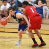 Cody Doolin drives past Jerome Seagears during their Desert Reign basketball league game Wednesday, June 18, 2014. Cody Doolin drives past Jerome Seagears during their Desert Reign basketball league game Wednesday, June 18, 2014.