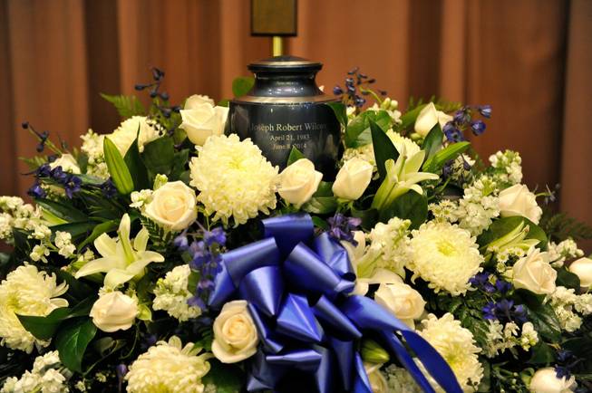 An urn containing the remains of Joseph Wilcox is displayed during a memorial service for him at Palm Downtown Mortuary and Cemetery on Sunday, June 22, 2014. Wilcox, 31, was killed trying to stop Jerad and Amanda Miller in the midst of their shooting spree at an east valley Walmart store on June 8.