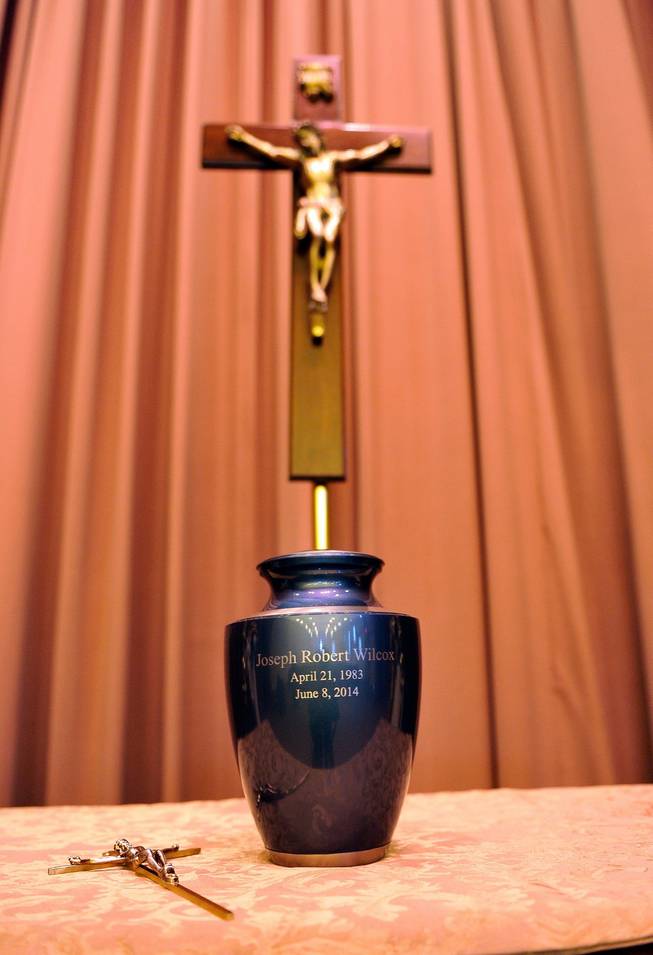 An urn containing the remains of Joseph Wilcox is displayed before a memorial service for him at Palm Downtown Mortuary and Cemetery on Sunday, June 22, 2014. Wilcox, 31, was killed trying to stop Jerad and Amanda Miller in the midst of their shooting spree at an east valley Walmart store on June 8.
