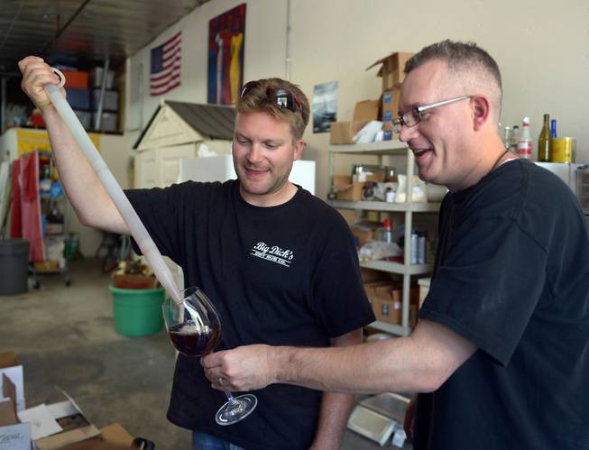Veteran Josh Laine, co-owner of Uncle Sam's Misguided Brewery, pours a sampling of Miracle Black Ale for fellow Marine Corps veteran Andy Kulakowski on Memorial Day in Livermore, Calif., on Monday, May 26, 2014. Free tastings were part of the day's event for all veterans.