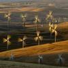 Photo: In this May 12, 2013, photo, wind turbines line th Photo: In this May 12, 2013, photo, wind turbines line th