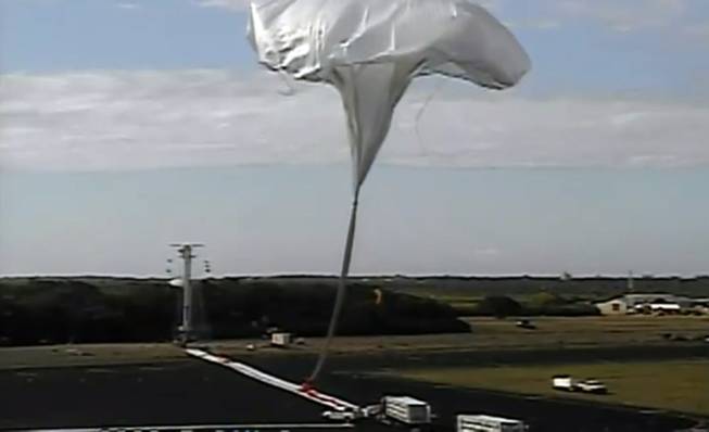 This image taken from video provided by NASA shows the launch of the high-altitude balloon carrying a saucer-shaped vehicle for NASA to test technology that could be used to land on Mars, Saturday, June 28, 2014, in Kauai, Hawaii. Saturday's experimental flight high in Earth's atmosphere tested a giant parachute designed to deliver heavier spacecraft and eventually astronauts.