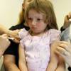 Photo: Holly Ann Haley, 4, gets two vaccinations at the d Photo: Holly Ann Haley, 4, gets two vaccinations at the d