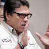 Photo: Texas Gov. Rick Perry talks to the media Monday, J Photo: Texas Gov. Rick Perry talks to the media Monday, J
