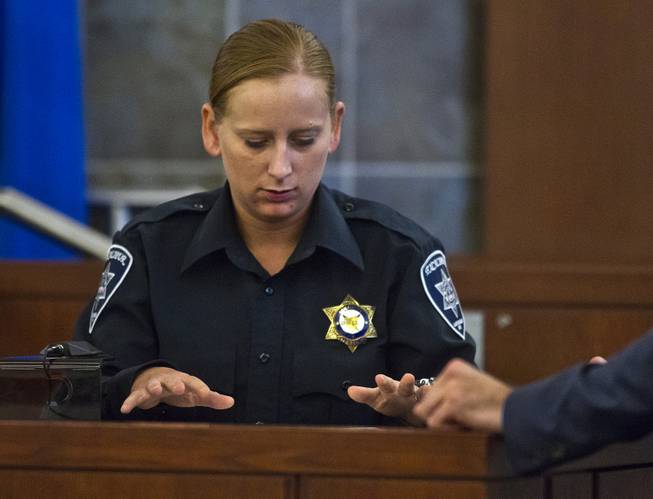 Excalibur security officer Kaylynn Kalmback points out on the map where suspect Joey Kadmiri was when she first encountered him as his trial begins Tuesday, July 8, 2014. He was allegedly beat up by the Thunder From Down Under Male Revue dancers after trying to burglarize their locker room.